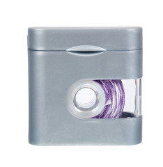 Dental floss in grey container isolated on white background.