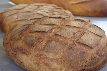 Freshly baked traditional bread for sale on the morning market.