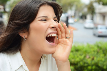 Young woman shouting and screaming.