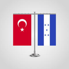 Table stand with flags of Turkey and Honduras.Two flag. Flag pole. Symbolizing the cooperation between the two countries. Table flags