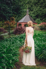 Fototapeta premium Bride carrying bouquet