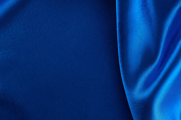 Abstract silk luxury background, piece of cloth, deep blue cloth texture