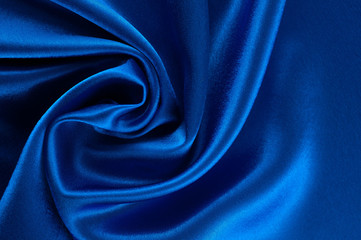 Abstract silk luxury background, piece of cloth, deep blue cloth texture