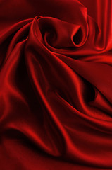 Abstract silk luxury background, piece of cloth, deep red cloth texture