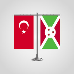 Table stand with flags of Turkey and Burundi.Two flag. Flag pole. Symbolizing the cooperation between the two countries. Table flags