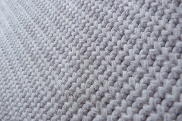 knitted knitted fabric close-up fine-wool from a wool of large mating handmade natural material textured background for a décor