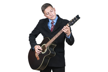 Obraz premium Businessman in suit playing acoustic on guitar, isolated on white background