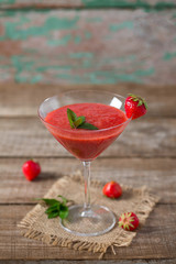 strawberry smoothie on wooden surface