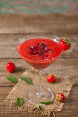 strawberry smoothie on wooden surface