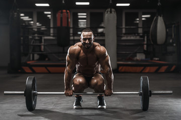 Brutal strong bodybuilder athletic men pumping up muscles with dumbbells