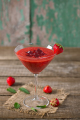 strawberry smoothie on wooden surface