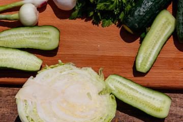 Ingredients for spring vegetable salad on rustic wooden table