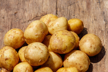 New potatoes on rustic wooden table
