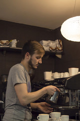 waiter making coffee in the pub