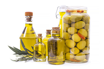 bottles of extra virgin olive oil and glass jar with olives isolated