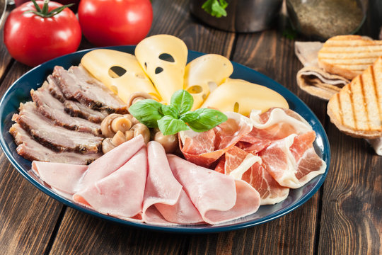 Cold meat platter with ham, prosciutto, bacon and cheese