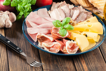 Cold meat platter with ham, prosciutto, bacon and cheese