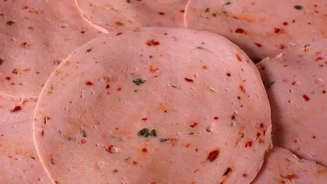 Meat pink pork parizer slices rotating pattern macro texture background backdrop footage video.