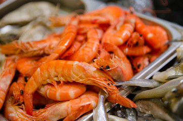 Raw shrimp and fish for sale.