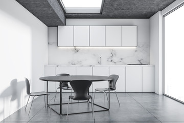 White and marble kitchen, round table