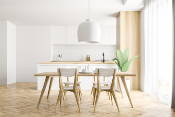 White and wooden kitchen interior, table