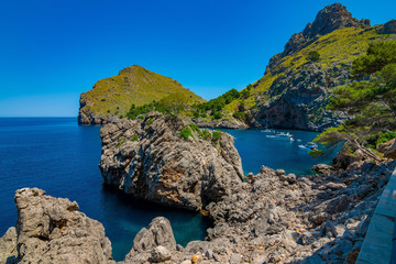 Fototapeta na wymiar A rugged coast on a sunny summer day without clouds in Majorca, Spain 2018