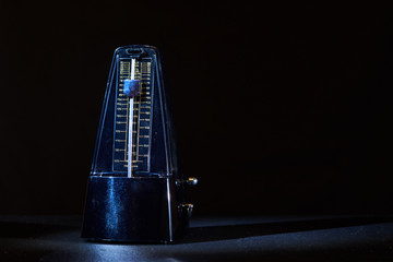 metronome on a dark background