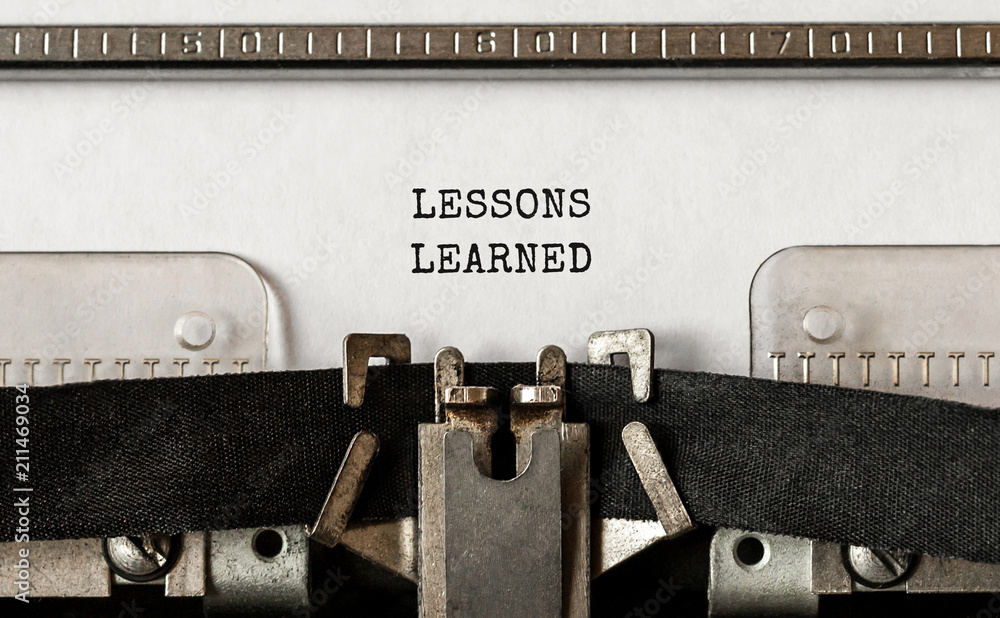 Aufkleber text lessons learned typed on retro typewriter