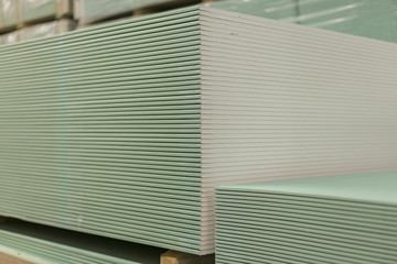 Pallet with plasterboard in the building store. Warehouse with plasterboard. sheets of plasterboard...