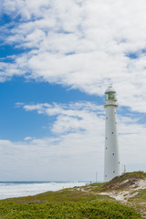 Lighthouse on a rugged coastline during the daytime