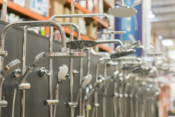Shower head on the stand in a hardware store. selected focus. set of shower heads.