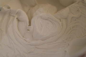 closeup putty in a bucket