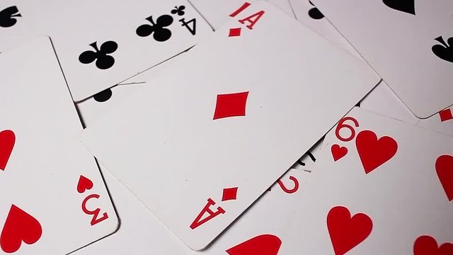 Playing cards. Poker card rotating pattern macro texture background backdrop footage video.