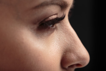 Closeup macro photo of woman's eyes with long lashes and natural makeup