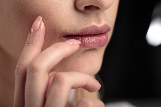 Closeup macro photo of woman's lips with natural lip balm