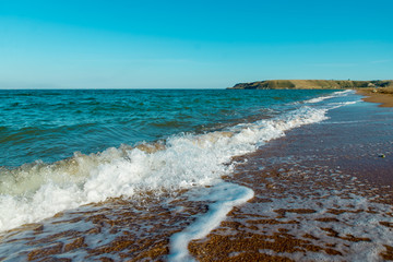 the movement of sea waves on the shore