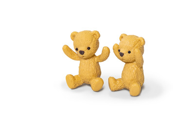 Two lovely miniature toys brown teddy bears sitting isolated on white background, with clipping path included.