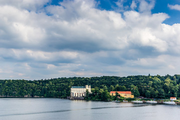 Obraz premium Orlik castle with blue sky and trees-Orlik nad Vltavou South Bohemia, Czech Republic
