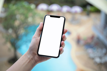 female hand holding phone with isolated screen background pool hotel