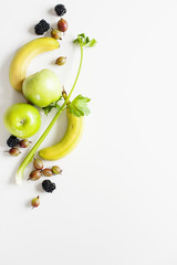 Yellow green fruit on a white background with empty space for text