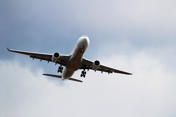 An airplane flying into the sky that I looked up from the front