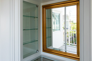 Golden mirror frame in dressing room
