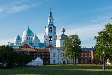 Spaso-Preobrazhensky Cathedral surrounded by cell buildings and lawn. Valaam is a cozy and quiet piece of land, the rocky shores of which rise above the lush waters of lake Ladoga