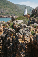Abandoned Lighthouse amid rocks