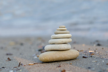 Fototapeta na wymiar Stones balance inspiration wellness concept. Harmony on the coast of the Sea.