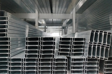 Rectangular metal pipes.Carbon steel tube section.Stainless steel rectangular bars in warehouse of metal products
