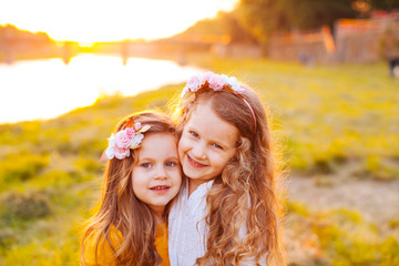 Two pretty friends hugging