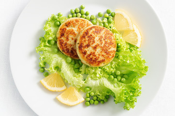 fish cutlets with garden vegetables and lemon