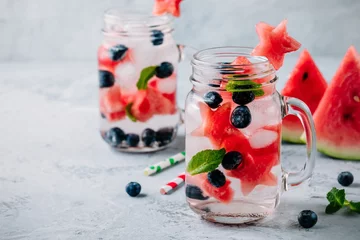 Schilderijen op glas Infused detox water with watermelon, mint and blueberry. © nblxer