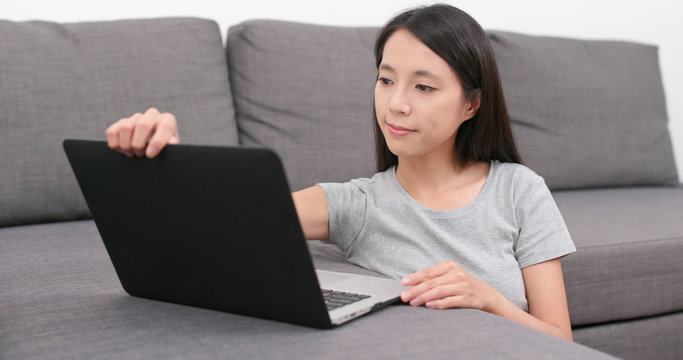 Woman look at laptop computer at home